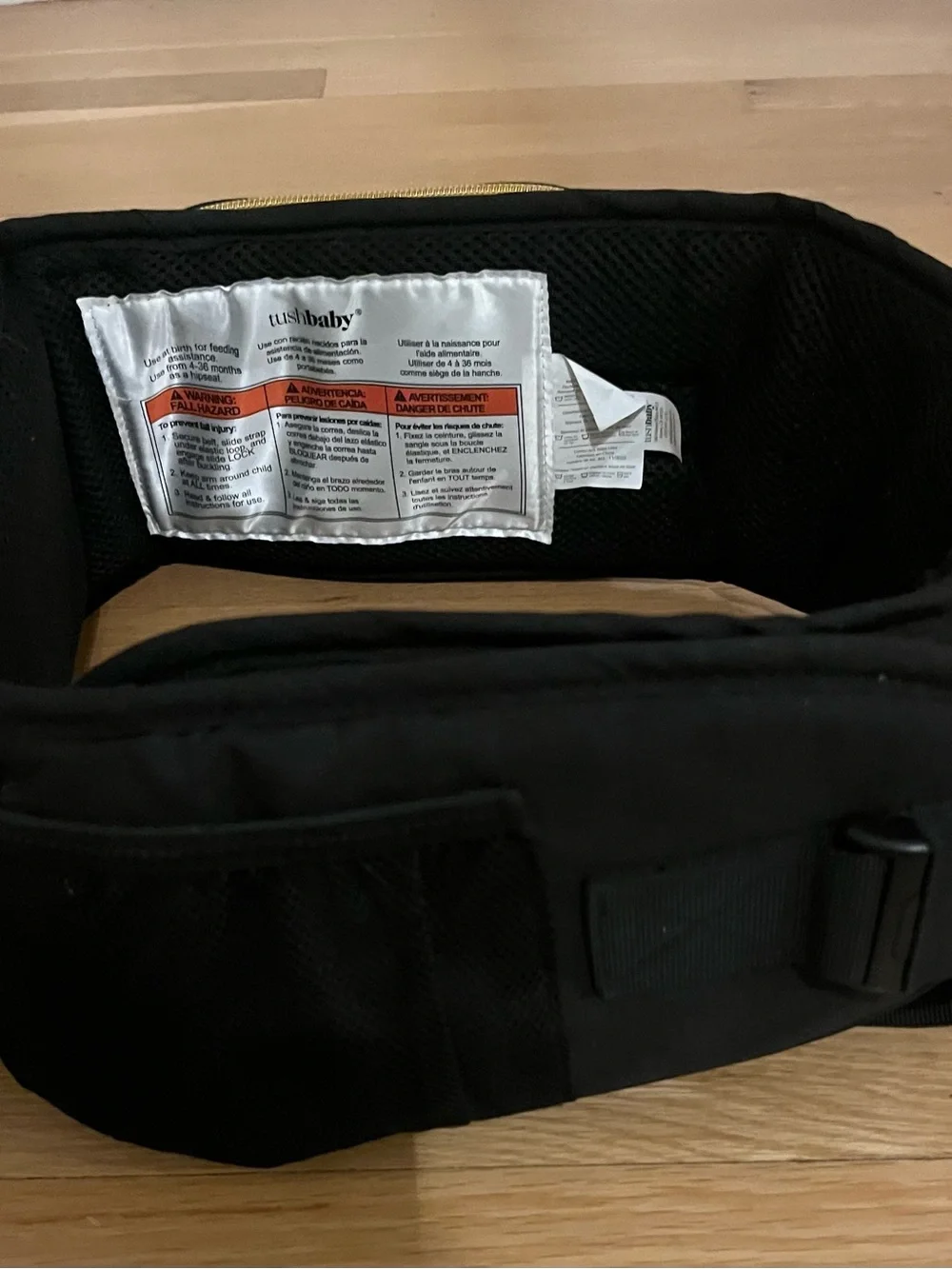 Black Tushbaby Baby Hip Bag with Gold Hardware